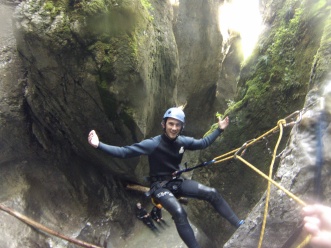 Rapeling down a waterfall in Slovenia